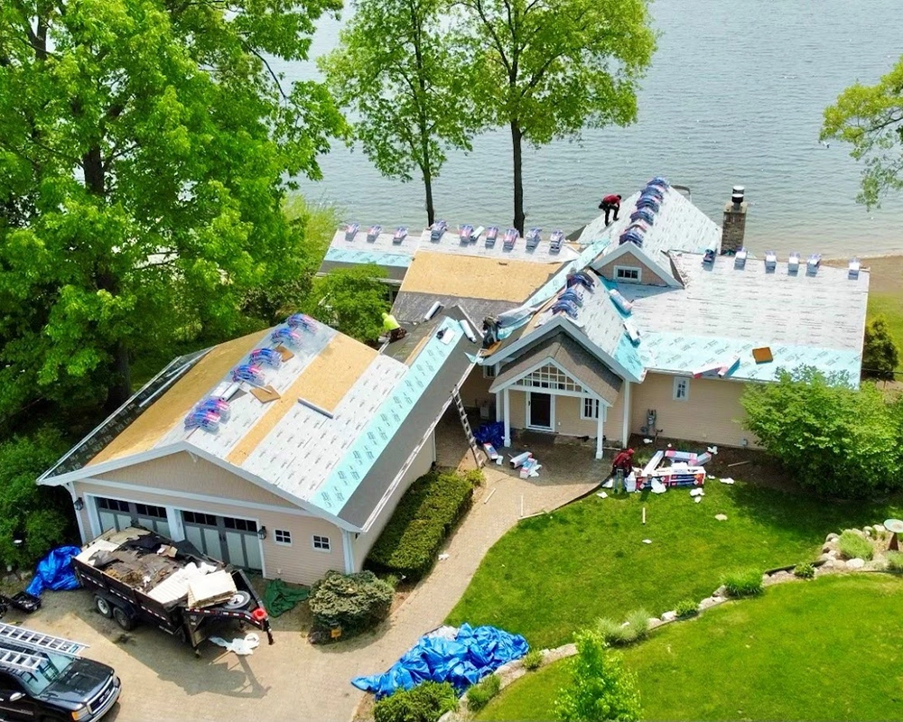 A roof replacement on a lake house by A.E. Roofing & Contracting